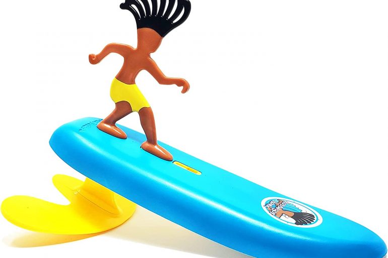 Surfer Dude Beach Toy catching a wave at the beach