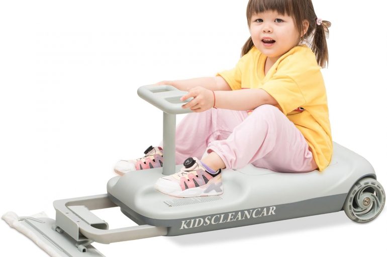 Little girl riding Kids Clean Car, a versatile ride-on toy with mop attachment